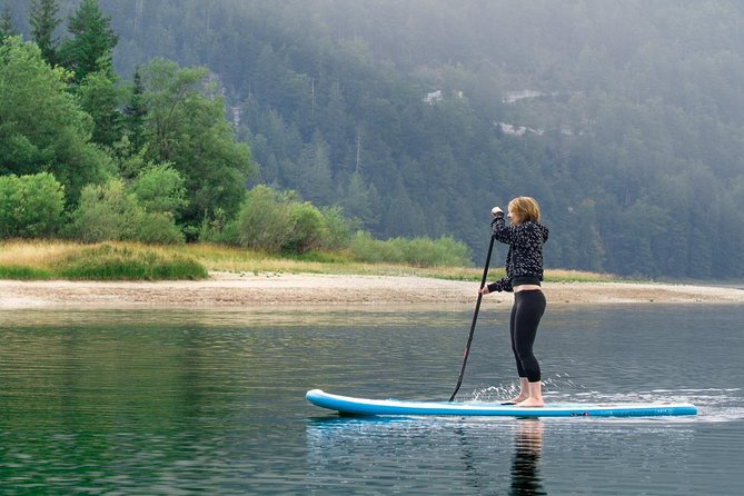 Half Day Stand-up Paddle Boarding (SUP) trip on Lake Predil - Paddling past beaches and freshwater springs