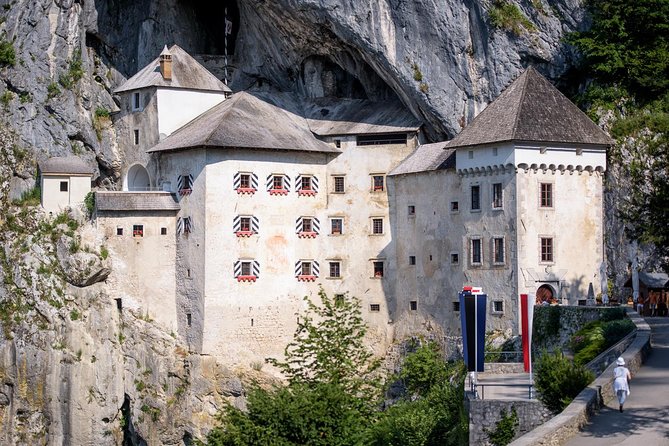 Postojna Cave & Photostop Predjama castle - Group Tour from Koper - Predjama Castle, a quick look from the road