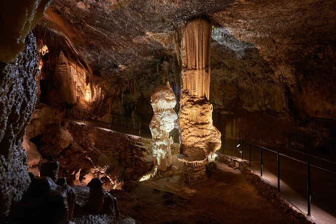 Postojna Cave & Predjama Castle - Small Group Tour from Koper - Inside Postojna Cave: train ride, stairs, and cold air